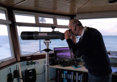 A watchkeeper looks out to sea. PHOTO: NCI