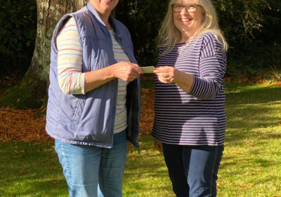 Lauren receiving her prize from Rowena Jecock
