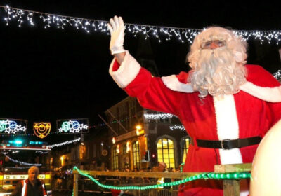 Santa waves to the crowd at a previous event