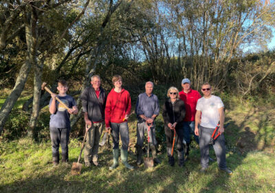 The team of volunteers with Luke, right