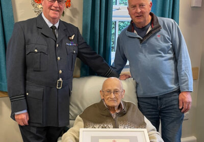 Gordon with, left, driver John Reid in his RAF uniform and right, son, Alan