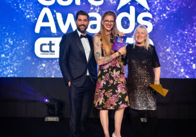 Lorna Parsons (centre) receives her Chef of the Year award from ITV presenter Matt Johnson and Jo Wildman, director of compliance, governance and quality Caring Homes