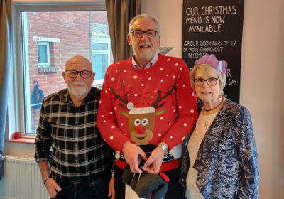 Swanage residents and Eat and Meet organisers Roy and Norma Hoppe (left and right) with Steve Churchill representing Heroes Haven