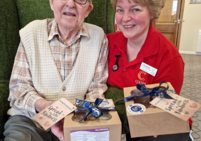 With shortbread gifts at Kingfishers in New Milton are resident Terry Vass and Companionship Team member Christina Holliday.
