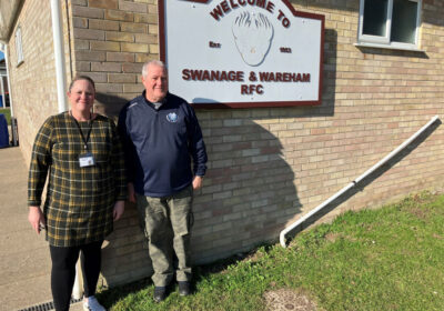Rachel Newman, of Age UK’s North, South and West Dorset branch, and Swanage and Wareham RFC chair Martin Hill