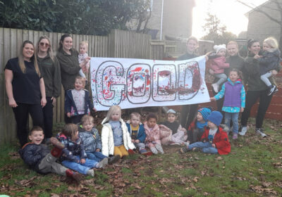Staff and children celebrate at Tops Corfe Mullen