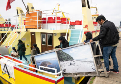 Family visitors board the Brownsea ferry.