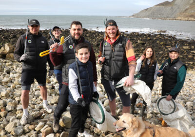 Chris Payne of Green Folk and human fish Oly Rush (centre) with volunteers during a Dorset beach clean
