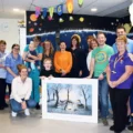 Katie (centre, with orange top) with Lorna to the right (in black) and Clare Hollingsworth to the left and members of the Kingfisher team