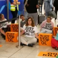 Mel Carrington, from Christchurch, (front centre) is believed to have been arrested at Gatwick. Picture: Just Stop Oil