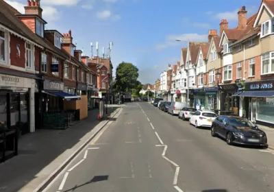 The woman was hurt as she helped her child out of the car in Western Road, Poole. Picture: Google