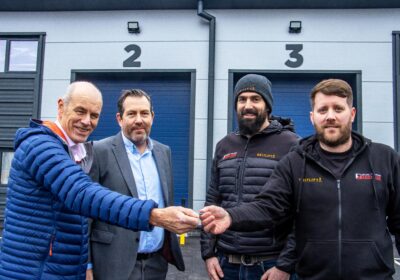 Cllr Richard Biggs hands over the keys to Liam Botting, managing director and Anthony Culshaw, technical director at Britlif, joined by Justin Ives, managing director, Spetisbury Construction who built the units Picture: Dorset Council