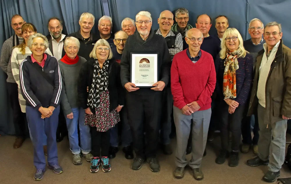 Purbeck Mining Museum volunteers with their Arts Council England accreditation. Picture: Andrew PM Wright