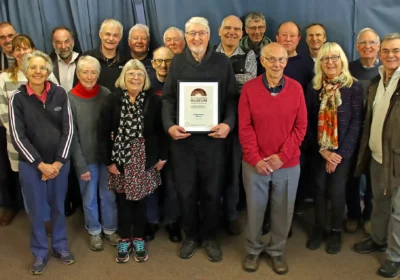 Purbeck Mining Museum volunteers with their Arts Council England accreditation. Picture: Andrew PM Wright