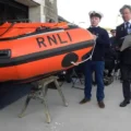 Darren Tomes prepares to Christen the lifeboat with Rob Pullman at his side. Picture: Christine Oliver