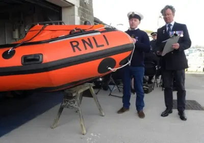Darren Tomes prepares to Christen the lifeboat with Rob Pullman at his side. Picture: Christine Oliver