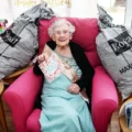 Kathleen surrounded by some of the 400-plus cards she received in Poole
