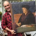 Actor Mark Rylance with the portrait from Wolf Hall that will be auctioned. Picture: Planet Purbeck