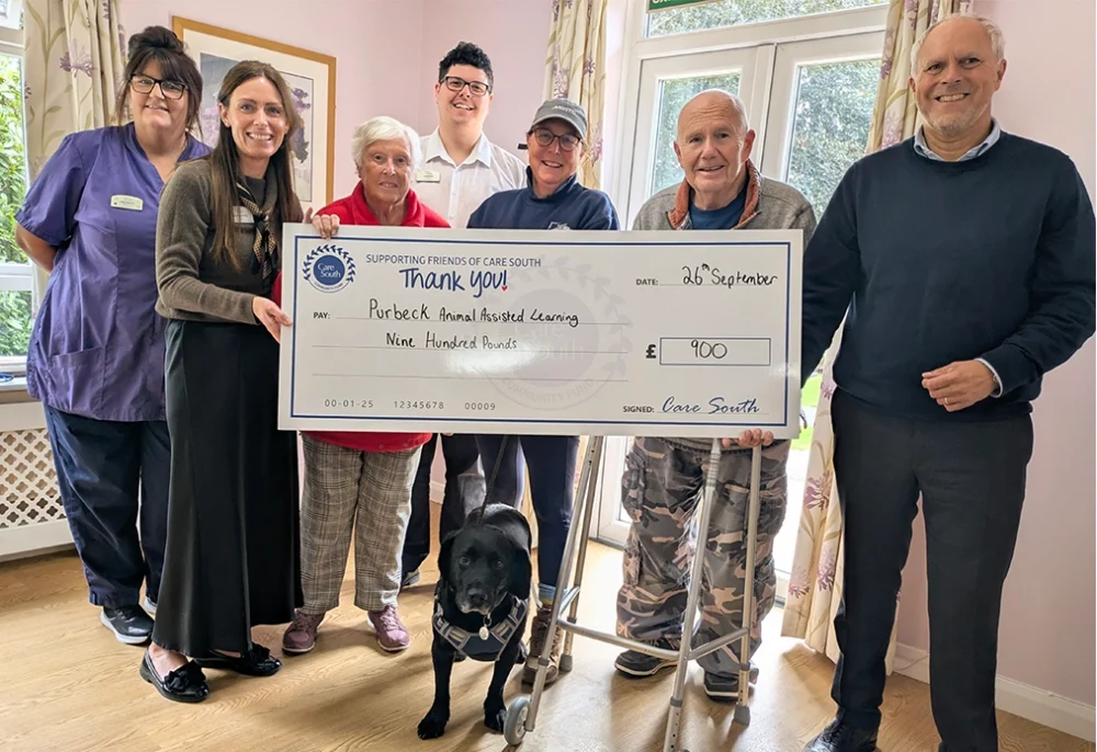 The team and residents handing the cheque to PAALS Picture: Care South
