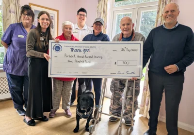 The team and residents handing the cheque to PAALS Picture: Care South