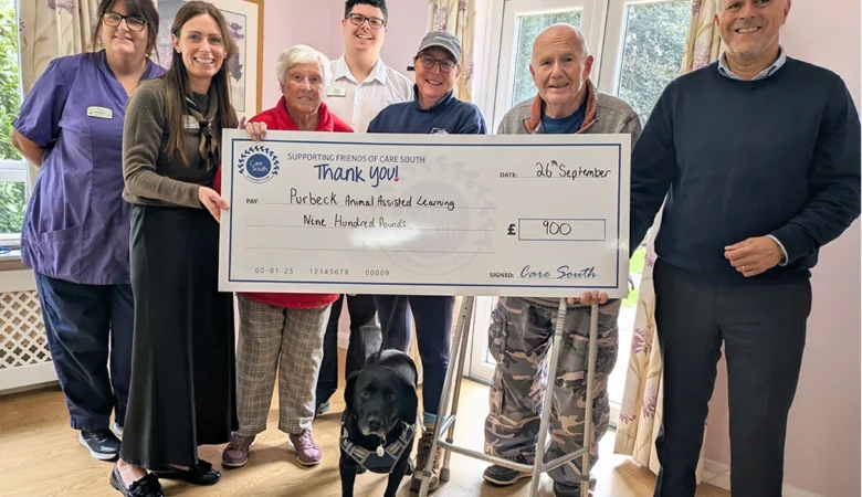 The team and residents handing the cheque to PAALS Picture: Care South